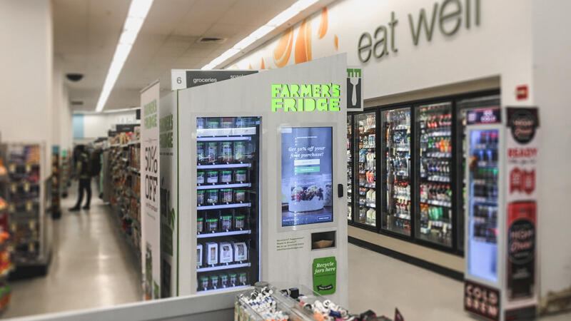 Interior view of a grocery store where a Farmer's Fridge kiosk is setup