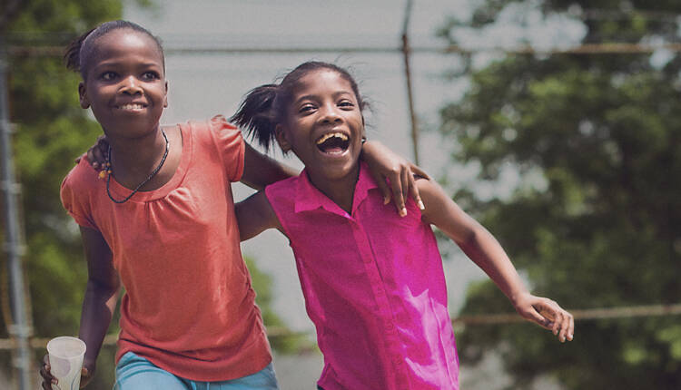 Two children playing together at a playground